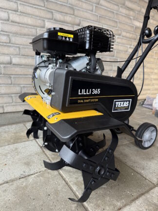 Havefræser foran mur